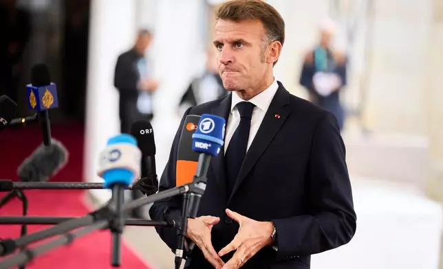 French President Emmanuel Macron arrives at an informal summit in the Danish parliament at Christiansborg Castle in Copenhagen, Wednesday, Oct. 1, 2025. (Thomas Traasdahl/Ritzau Scanpix via AP)