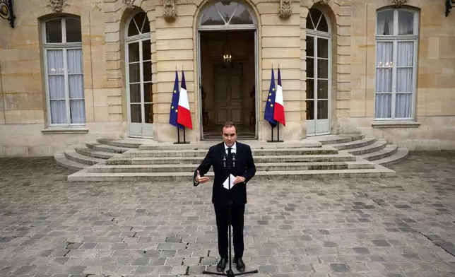 French outgoing Prime Minister Sebastien Lecornu, who resigned just a day after naming his government, delivers his statement at the Hotel Matignon in Paris, Monday, Oct. 6, 2025. (Stephane Mahe/Pool via AP)