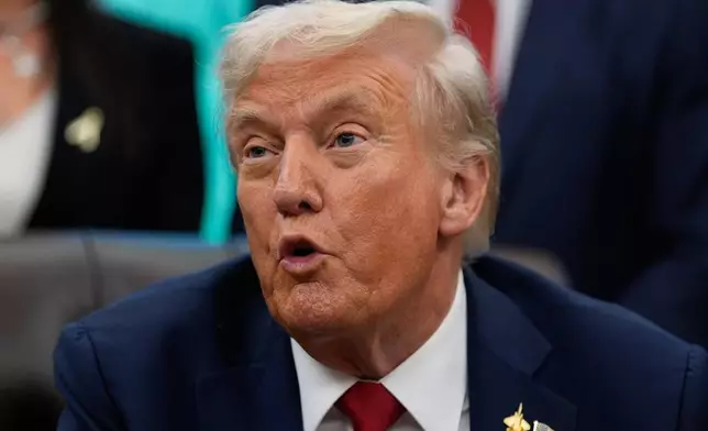 President Donald Trump speaks in the Oval Office of the White House before signing an executive order regarding childhood cancer and the use of AI, Tuesday, Sept. 30, 2025, in Washington. (AP Photo/Alex Brandon)