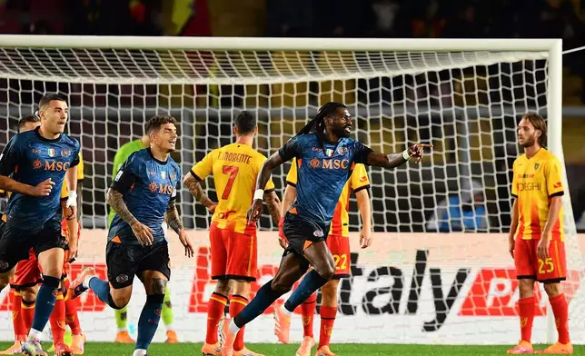 Napoli's Frank Anguissa, center, celebrates scoring during the Serie A soccer match between Lecce and Napoli, in Lecce, Italy, Tuesday Oct. 28, 2025. (Giovanni Evangelista/LaPresse via AP)