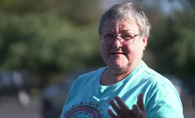 Janie Brown, 64, a resident of McEwen, Tenn. speaks to a journalist after the vigil held at Hurricane Chapel in McEwen, Tenn., on Saturday, Oct. 11, 2025, for victims of a blast that leveled an explosives plant. (AP Photo/Obed Lamy)