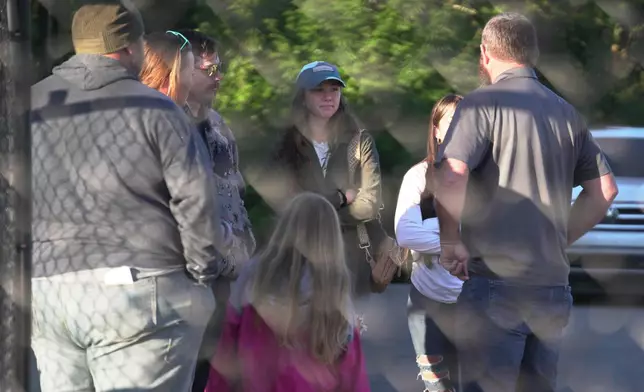 Family members gather at Accurate Energetic Systems, an explosive plant, after a blast on Friday resulted in multiple fatalities and several missing on Saturday, Oct 11, 2025, in Bucksnort, Tenn. (AP photo/ Obed Lamy)