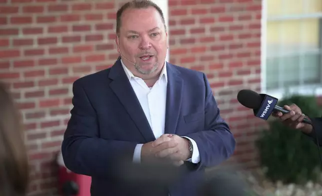 Tim Farris, Hurricane Chapel senior pastor, speaks to the press after a vigil at his church in McEwen, Tenn., on Saturday, Oct. 11, 2025, for victims of a blast that leveled an explosives plant. (AP Photo/Obed Lamy)
