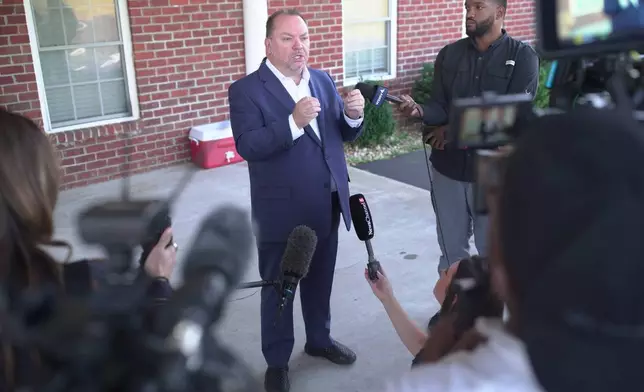Tim Farris, Hurricane Chapel senior pastor, speaks to the press after a vigil at his church in McEwen, Tenn., on Saturday, Oct. 11, 2025, for victims of a blast that leveled an explosives plant. (AP Photo/Obed Lamy)