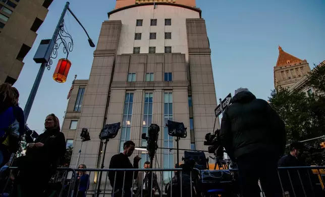 Media waits outside the Manhattan federal court for the sentencing of Sean "Diddy" Combs in New York, Friday, Oct. 3, 2025. (AP Photo/Eduardo Munoz Alvarez)