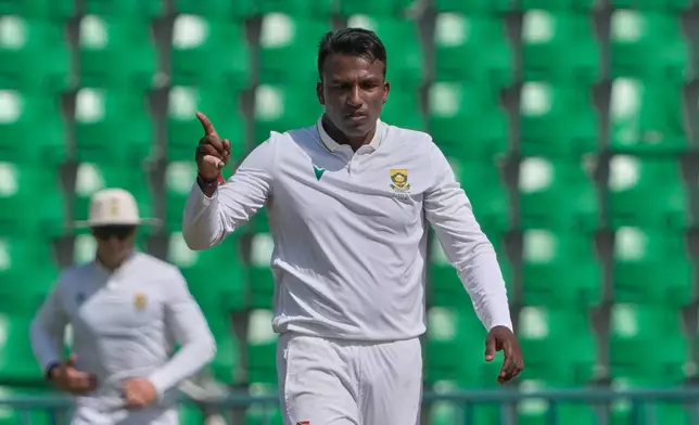 South Africa's Senuran Muthusamy celebrates after taking the wicket of Pakistan's Noman Ali during the second day of the first test cricket match between Pakistan and South Africa, in Lahore, Pakistan, Monday, Oct. 13, 2025. (AP Photo/K.M. Chaudary)