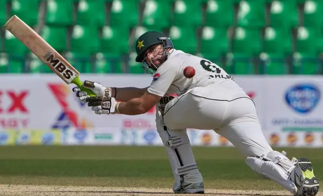 Pakistan's Salman Ali Agha plays a shot during the second day of the first test cricket match between Pakistan and South Africa, in Lahore, Pakistan, Monday, Oct. 13, 2025. (AP Photo/K.M. Chaudary)