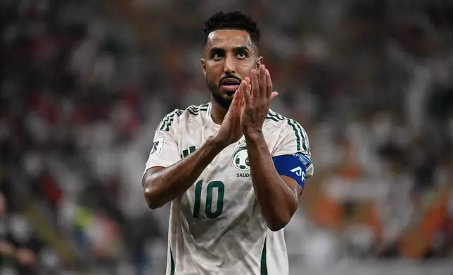 Saudi Arabia's Salem Al Dawsari applauds fans during the World Cup 2026 Asian qualifier fourth-round Group B soccer match between Saudi Arabia and Indonesia at Alinma Bank Stadium in King Abdullah Sports City, in Jiddah, Saudi Arabia, Wednesday, Oct. 8, 2025. (AP Photo)