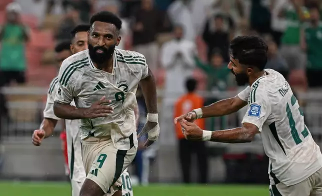Saudi Arabia's Feras Albrikan, left, celebrates after scoring his side's opening goal during the World Cup 2026 Asian qualifier fourth-round Group B soccer match between Saudi Arabia and Indonesia at Alinma Bank Stadium in King Abdullah Sports City, in Jiddah, Saudi Arabia, Wednesday, Oct. 8, 2025. (AP Photo)