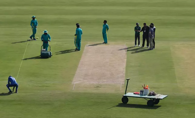 Ground staff prepare pitch for second test cricket match between Pakistan and South Africa, at the Rawalpindi Cricket Stadium, in Rawalpindi, Pakistan, Sunday, Oct. 19, 2025. (AP Photo)