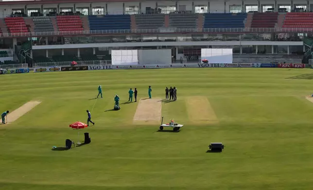 Ground staff prepare pitch for second test cricket match between Pakistan and South Africa, at the Rawalpindi Cricket Stadium, in Rawalpindi, Pakistan, Sunday, Oct. 19, 2025. (AP Photo)