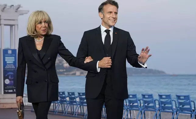 FILE - French President Emmanuel Macron and his wife Brigitte Macron pose before a dinner ahead of the UN Ocean Conference Sunday, June 8, 2025 in Nice, French Riviera. (AP Photo/Laurent Cipriani, file)