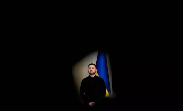 Ukraine's President Volodymyr Zelenskyy listens as High Representative of the European Union for Foreign Affairs and Security Policy Kaja Kallas speaks during a news conference, Monday, Oct. 13, 2025, in Kyiv, Ukraine. (AP Photo/Julia Demaree Nikhinson)