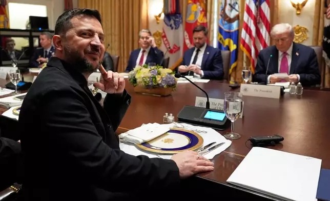 Ukraine's President Volodymyr Zelenskyy, left, sits before a meeting with President Donald Trump, from right, Vice President JD Vance and Treasury Secretary Scott Bessent in the Cabinet Room of the White House, Friday, Oct. 17, 2025, in Washington. (AP Photo/Alex Brandon)