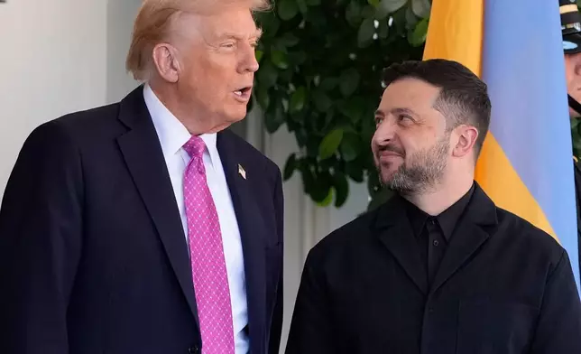 President Donald Trump, left, greets Ukraine's President Volodymyr Zelenskyy at the White House, Friday, Oct. 17, 2025, in Washington. (AP Photo/Alex Brandon)