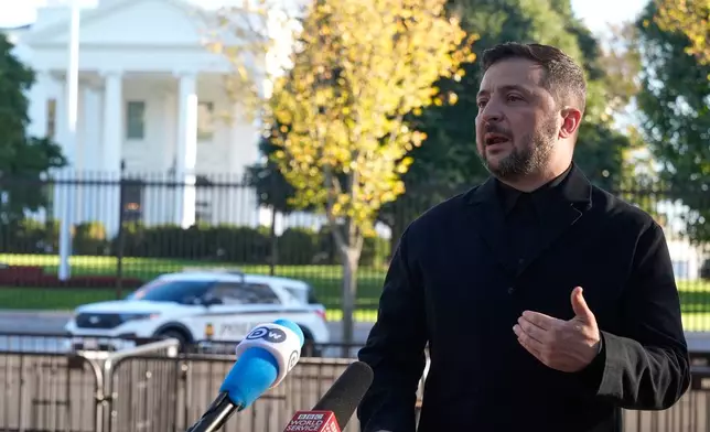Ukraine's President Volodymyr Zelenskyy speaks to reporters in Lafayette Park across the street from the White House, following a meeting with President Donald Trump, Friday, Oct. 17, 2025, in Washington. (AP Photo/Manuel Balce Ceneta)