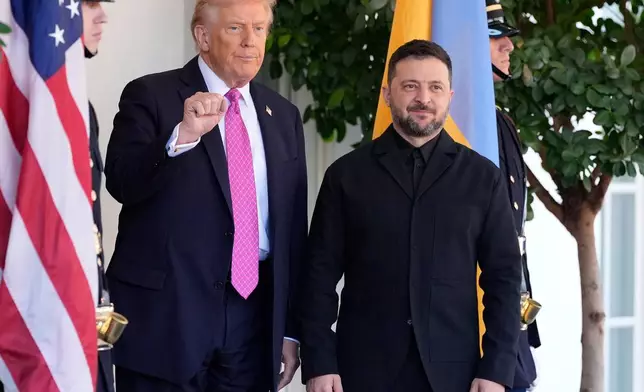 President Donald Trump, left, gestures as he greets Ukraine's President Volodymyr Zelenskyy at the White House, Friday, Oct. 17, 2025, in Washington. (AP Photo/Alex Brandon)