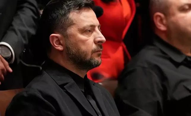 Ukraine's President Volodymyr Zelenskyy listens as President Donald Trump speaks before a lunch in the Cabinet Room of the White House, Friday, Oct. 17, 2025, in Washington. (AP Photo/Alex Brandon)