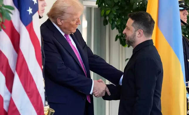 President Donald Trump, left, greets Ukraine's President Volodymyr Zelenskyy at the White House, Friday, Oct. 17, 2025, in Washington. (AP Photo/Alex Brandon)