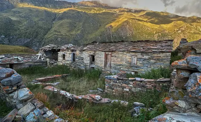 Lichen grows on walls of abandoned stone houses in Martoli village, in the northern Indian Himalayan state of Uttarakhand, Oct. 4, 2025. (AP Photo/Satish Sharma)