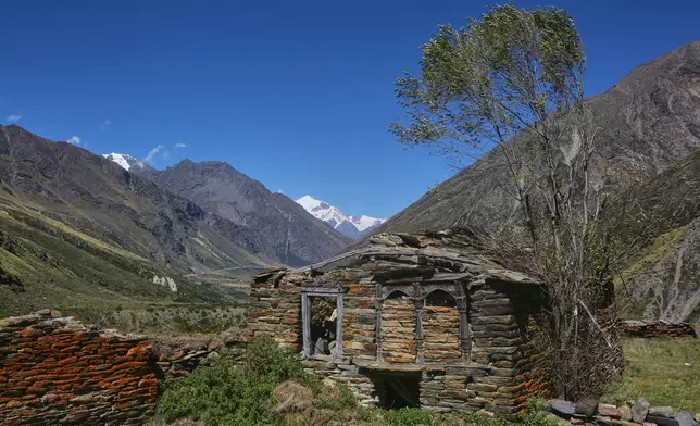 Lichen grows on the stone walls of a structure in the abandoned village of Martoli, in the northern Indian Himalayan state of Uttarakhand, on Oct. 4, 2025. (AP Photo/Satish Sharma)
