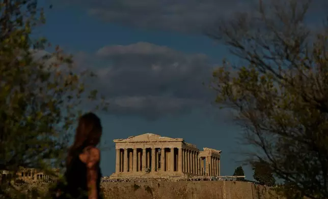 The 5th century B.C. Parthenon temple stands free of scaffolding on the Acropolis hill in Athens, Friday, Oct. 10, 2025, after the removal of restoration structures that had covered parts of the ancient monument for decades.(AP Photo/Petros Giannakouris)