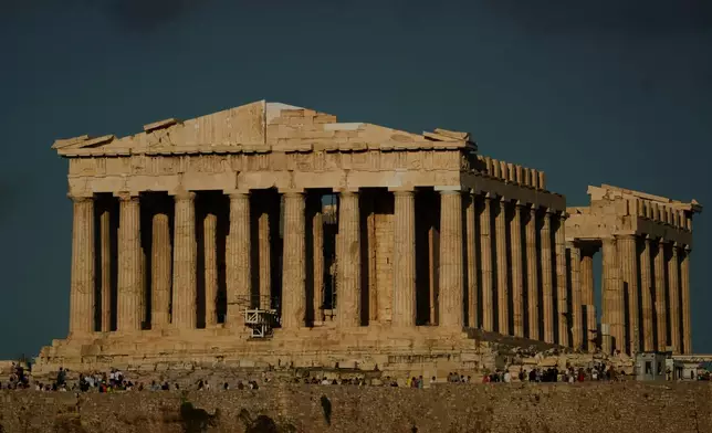 The 5th century B.C. Parthenon temple stands free of scaffolding on the Acropolis hill in Athens, Friday, Oct. 10, 2025, after the removal of restoration structures that had covered parts of the ancient monument for decades.(AP Photo/Petros Giannakouris)