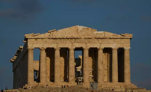 The 5th century B.C. Parthenon temple stands free of scaffolding on the Acropolis hill in Athens, Friday, Oct. 10, 2025, after the removal of restoration structures that had covered parts of the ancient monument for decades.(AP Photo/Petros Giannakouris)