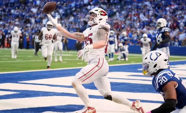Arizona Cardinals' Trey McBride reacts after catcing a touchdown pass during the second half of an NFL football game against the Indianapolis Colts Sunday, Oct. 12, 2025, in Indianapolis. (AP Photo/Michael Conroy)