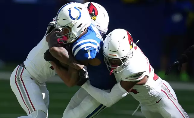 Indianapolis Colts wide receiver Josh Downs (1) runs against Arizona Cardinals safety Jalen Thompson (34) in the first half of an NFL football game, Sunday, Oct. 12, 2025, in Indianapolis, Ind. (AP Photo/Michael Conroy)