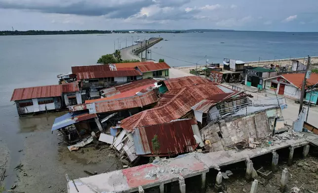 Business establishments that were damaged due to a recent strong earthquake lie at the Bogo city pier, Cebu Province, Central Philippines on Friday, Oct. 3, 2025. (AP Photo/Aaron Favila)
