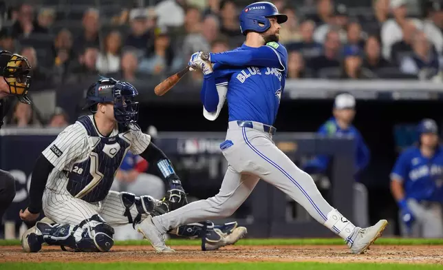 Toronto Blue Jays' Nathan Lukes connects for a two-run RBI single against the New York Yankees during the seventh inning of Game 4 of baseball's American League Division Series, Wednesday, Oct. 8, 2025, in New York. (AP Photo/Frank Franklin II)