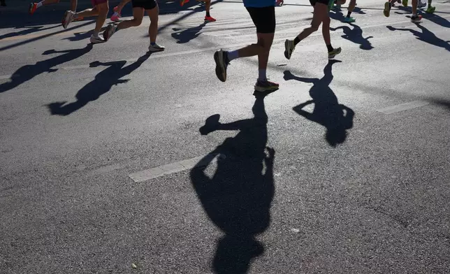 Runners participate in the Chicago Marathon, Sunday, Oct. 12, 2025. (AP Photo/Nam Y. Huh)