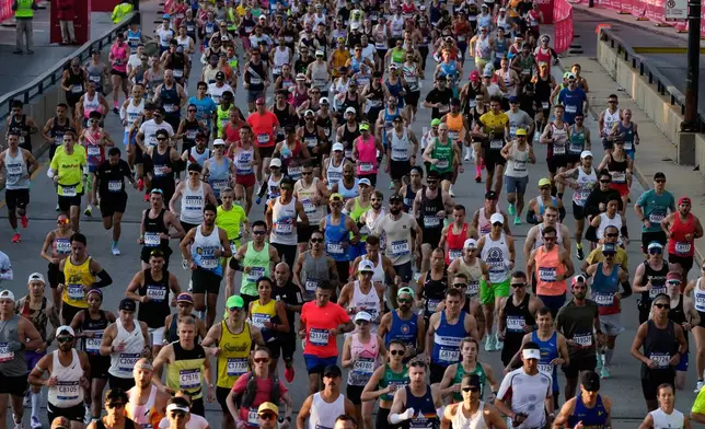 Runners participate in the Chicago Marathon, Sunday, Oct. 12, 2025. (AP Photo/Nam Y. Huh)