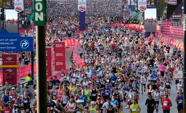 Runners participate in the Chicago Marathon, Sunday, Oct. 12, 2025. (AP Photo/Nam Y. Huh)
