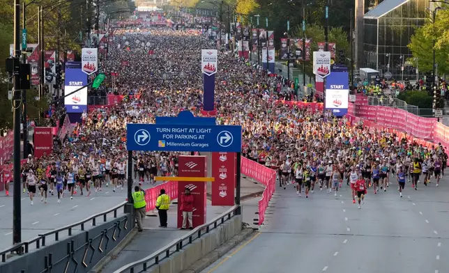 Runners participate in the Chicago Marathon, Sunday, Oct. 12, 2025. (AP Photo/Nam Y. Huh)