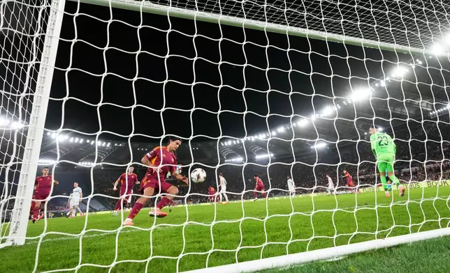 Roma's Paulo Dybala retrieves the ball after scores his side's only goal, from the penalty spot, during the Europa League opening phase soccer match between AS Roma and Viktoria Plzen in Rome, Thursday, Oct. 23, 2025. (AP Photo/Alessandra Tarantino)