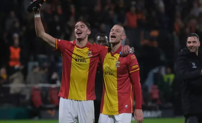 Go Ahead Eagles' Milan Smit, left, and Joris Kramer celebrate after the Europa League soccer match between Go Ahead Eagles and Aston Villa in Deventer, Netherlands, Thursday, Oct. 23, 2025. (AP Photo/Patrick Post)