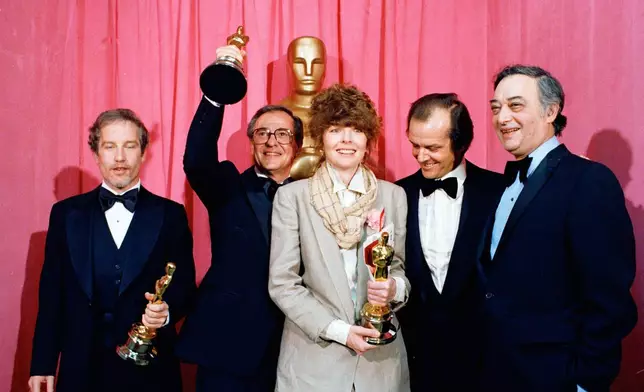 FILE - Oscar winners pose with their statuettes at the Academy Awards presentation in Los Angeles, April 3, 1978, from left: Richard Dreyfuss, best actor for "The Goodbye Girl"; Charles H. Joffe, best picture for "Annie Hall"; Diane Keaton, best actress for "Annie Hall"; presenter Jack Nicholson, and producer Jack Rollins of United Artists. (AP Photo, File)