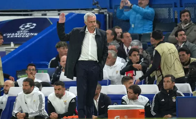 Benfica's head coach Jose Mourinho reacts during a Champions League opening phase soccer match between Chelsea and SL Benfica at Stamford Bridge stadium in London, Tuesday, Sept. 30, 2025. (AP Photo/Kin Cheung)