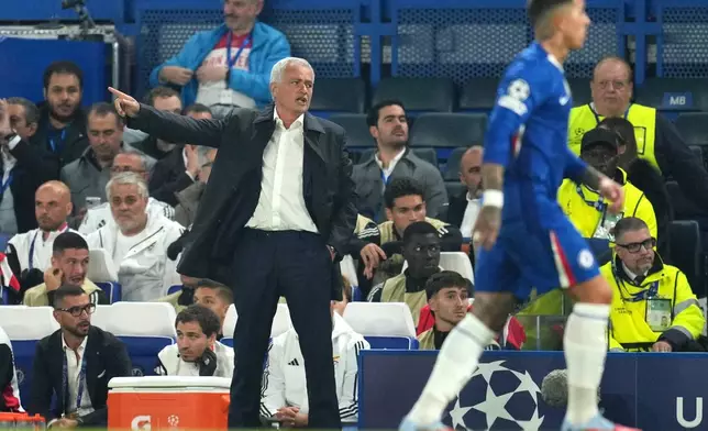 Benfica's head coach Jose Mourinho gestures during a Champions League opening phase soccer match between Chelsea and SL Benfica at Stamford Bridge stadium in London, Tuesday, Sept. 30, 2025. (AP Photo/Kin Cheung)
