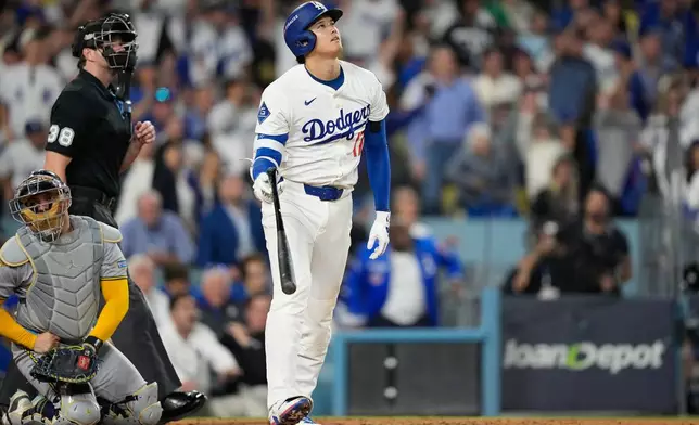 Los Angeles Dodgers' Shohei Ohtani celebrates his home run against the Milwaukee Brewers during the fourth inning in Game 4 of baseball's National League Championship Series, Friday, Oct. 17, 2025, in Los Angeles. (AP Photo/Brynn Anderson)