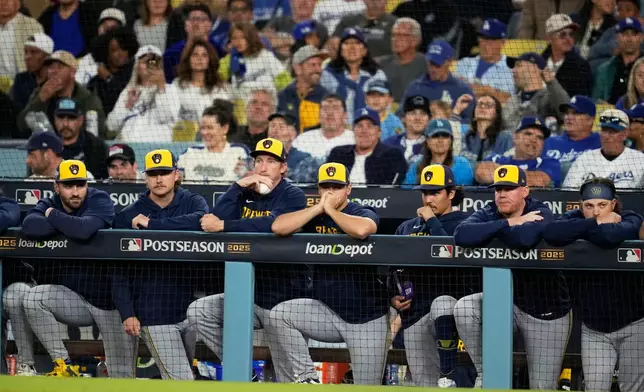 Members of the Milwaukee Brewers watch during the eighth inning in Game 4 of baseball's National League Championship Series against the Los Angeles Dodgers, Friday, Oct. 17, 2025, in Los Angeles. (AP Photo/Ashley Landis)