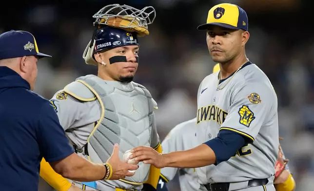 Milwaukee Brewers pitcher Jose Quintana leaves the game against the Los Angeles Dodgers during the third inning in Game 4 of baseball's National League Championship Series, Friday, Oct. 17, 2025, in Los Angeles. (AP Photo/Brynn Anderson)