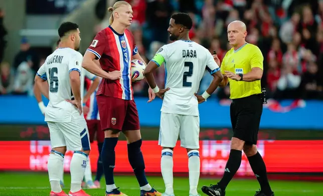Norway's Erling Braut Haaland holds the ball prior to a penalty kick, during the World Cup qualifying soccer match between Norway and Israel in Oslo, Saturday, Oct. 11, 2025. (Jonas Been Henriksen/NTB Scanpix via AP)