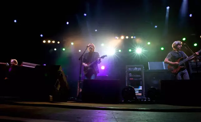 FILE - Phish band members Page McConnell, Trey Anastasio, Mike Gordon, from left, performs during their benefit concert at the Champlain Valley Exposition in Essex Junction, Vt, on Wednesday, Sept. 14, 2011. (AP Photo/Alison Redlich, File)
