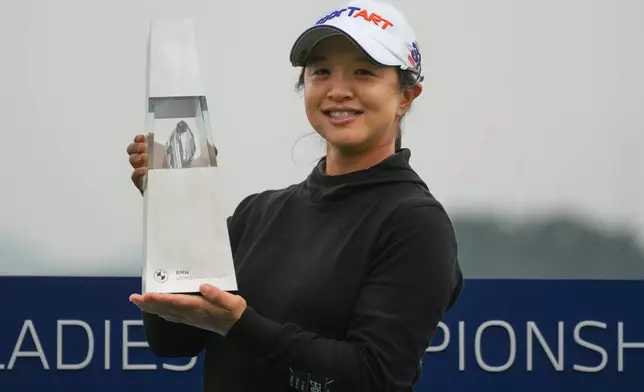Sei Young Kim of South Korea holds the winning trophy during the awards ceremony after winning the LPGA Ladies Championship golf tournament at the Pine Beach Golf Links, in Haenam, South Korea, Sunday, Oct. 19, 2025. (AP Photo/Lee Jin-man)
