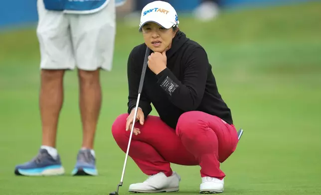 Sei Young Kim of South Korea lines up putt on the 18th green during the final round of the LPGA Ladies Championship golf tournament at the Pine Beach Golf Links, in Haenam, South Korea, Sunday, Oct. 19, 2025. (AP Photo/Lee Jin-man)