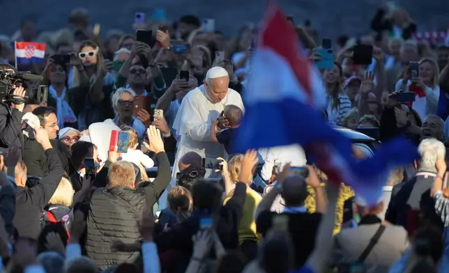 Pope Leo XIV greets pilgrims from Croatia in St. Peter's Square at the Vatican, Tuesday, Oct. 7, 2025. (AP Photo/Andrew Medichini)