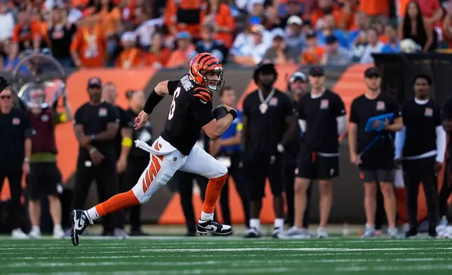 Cincinnati Bengals quarterback Jake Browning (6) runs the ball against the Detroit Lions during the first half of an NFL football game Sunday, Oct. 5, 2025, in Cincinnati. (AP Photo/Carolyn Kaster)
